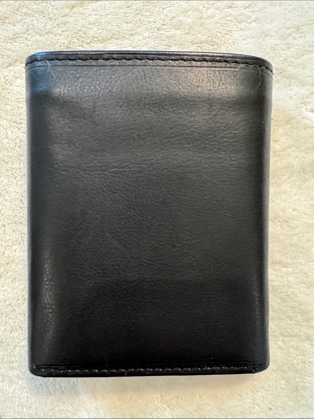 NWOT Lord & Taylor black leather tri-fold wallet.